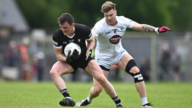 Finnian Cawley, Sligo, and Kevin O'Callaghan, Kildare, in action at Markievicz Park. Photo by Ramsey Cardy/Sportsfile