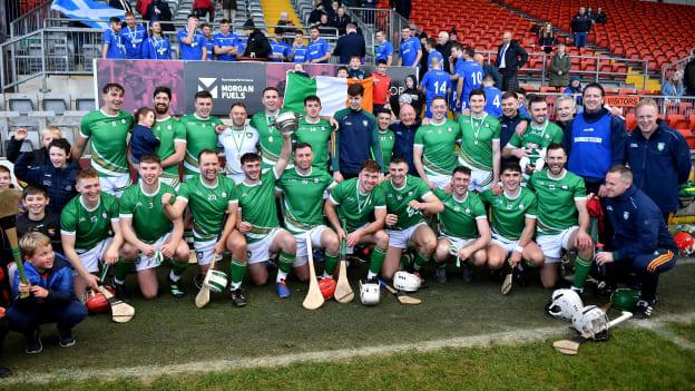 Ireland players and backroom staff celebrate with the Mowi Quaich after the 2023 Hurling Shinty International Game between Ireland and Scotland at Páirc Esler in Newry, Down. Photo by Piaras Ó Mídheach/Sportsfile.