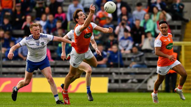 Jarlath Óg Burns, supported by Jemar Hall of Armagh, right, in action against Monaghan players Ryan McAnespie, left, and Karl O'Connell during the GAA Football All-Ireland Senior Championship Round 2 match between Monaghan and Armagh at St Tiarnach's Park in Clones, Monaghan. 