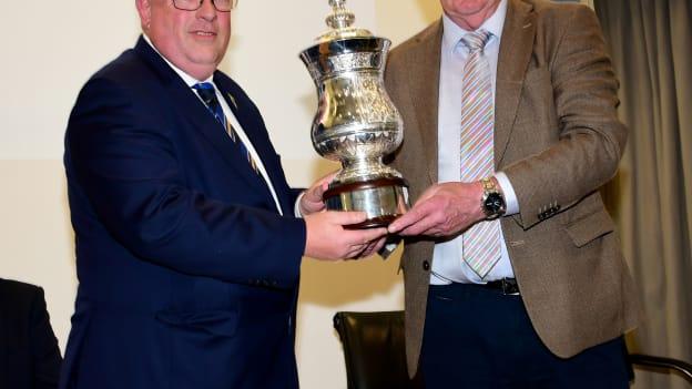 The John Doyle Cup is presented to Munster GAA Chairperson, Ger Ryan, on behalf of the Doyle family by Johnny Doyle. 
