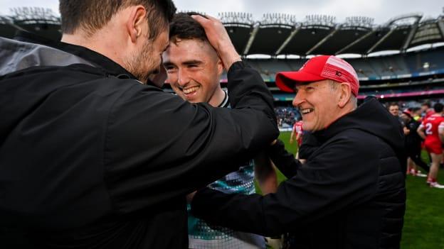 Derry goalkeeper Odhran Lynch, centre, is congratulated by Christopher McKaigue, left, and manager Mickey Harte during the Allianz Football League Division 1 Final match between Dublin and Derry at Croke Park in Dublin. Photo by Ramsey Cardy/Sportsfile