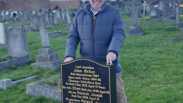 Patrick McKay pictured visiting the gravestone of his great-grandfather and founder of the GAA, John McKay. 