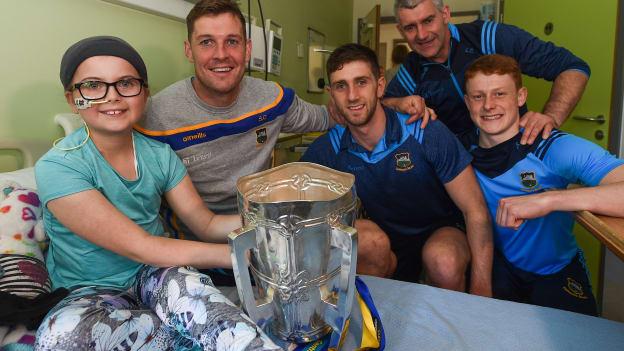 Carla O'Connor aged 10, from Carrick on Suir, Co Tipperary, with, Tipperary players, from left, Séamus Callanan, Barry Heffernan, Jerome Cahill, Tipperary manager Liam Sheedy, and the Liam MacCarthy cup on a visit by the Tipperary All-Ireland hurling champions to Children's Health Ireland at Crumlin in Dublin