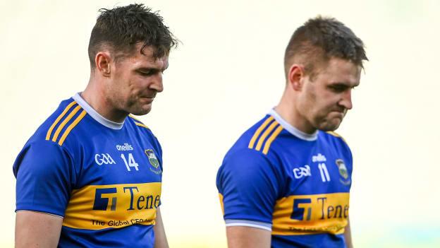 Tipperary players Séamus Callanan, left, and John McGrath leave the field dejected after the GAA Hurling All-Ireland Senior Championship Quarter-Final match between Galway and Tipperary at LIT Gaelic Grounds in Limerick. 
