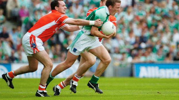 Fermanagh captain, Shane McDermott, charges through the tackles of Armagh's Aidan O'Rourke (left) and Tony McEntee in the 2004 All-Ireland SFC Quarter-Final. 