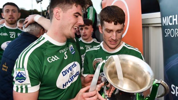 Daire O'Baoill and Christopher McFadden of Gaoth Dobhair with the Maguire cup after defeating Naomh Conaill Glenties in the Donegal SFC Final. 