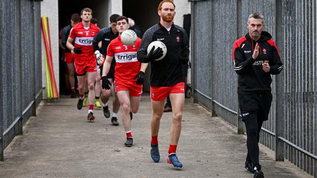 Conor Glass of Derry leads his side out, alongside Derry manager Rory Gallagher, before the Ulster GAA Football Senior Championship Quarter-Final match between Fermanagh and Derry at Brewster Park in Enniskillen, Fermanagh. Photo by Ramsey Cardy/Sportsfile.