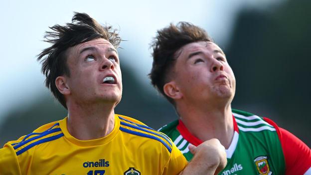 Ben O'Carroll of Roscommon and Ruairí Keane of Mayo watch the dropping ball during the EirGrid Connacht GAA Football U20 Championship Final match between Mayo and Roscommon at Elverys MacHale Park in Castlebar, Mayo. 
