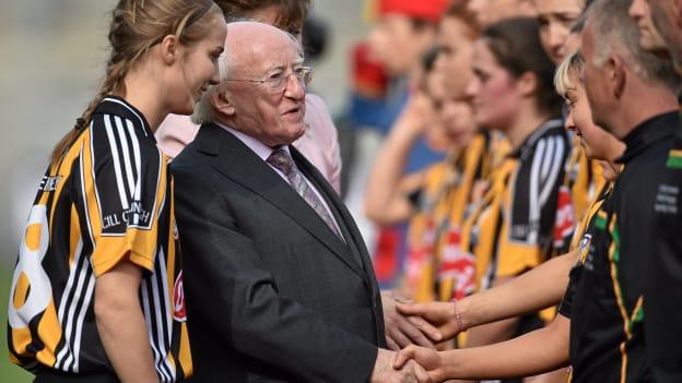 President of Ireland Michael D. Higgins is introduced to the Kilkenny team by captain Leann Fennelly before the 2014 All-Ireland Senior Camogie Final. 