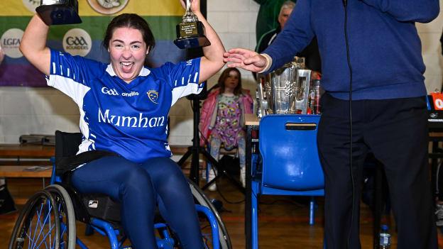 Munster captain Ellie Sheehy lifting the cups after the M.Donnelly GAA Wheelchair Hurling / Camogie All-Ireland Finals 2022 at Ashbourne Community School in Ashbourne, Meath.