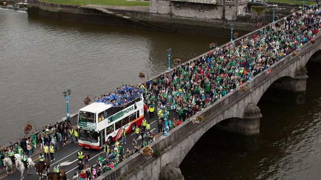 Thousands of Limerick supporters follow the Limerick hurling team's bus over Sarsfield bridge in Limerick city for the 2018 All-Ireland SHC winner's homecoming. 