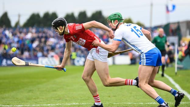 Robert Downey of Cork in action against Michael Kiely of Waterford during the Munster GAA Hurling Senior Championship Round 4 match between Waterford and Cork at Walsh Park in Waterford. 