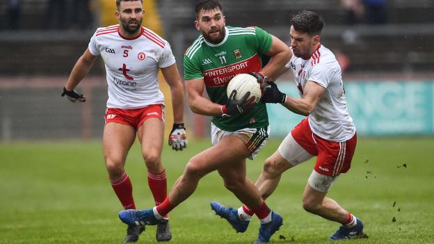 Aidan O'Shea, Mayo, challenged by Tyrone's Tiernan McCann and Mattie Donnelly during a 2019 Allianz Football League Division One encounter at Healy Park.