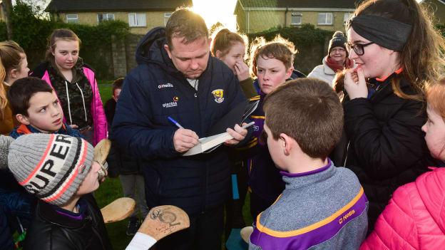 Wexford manager Davy Fitzgerald signs autographs after the Bord Na Mona Walsh Cup win over Kilkenny.