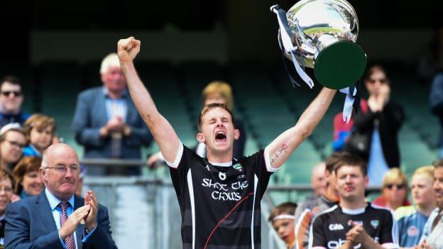 Sligo captain Keith Raymond lifts the Lory Meagher Cup after victory over Lancashire in 2018.