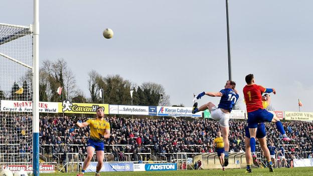 Martin Reilly of Cavan out-jumps Darren O’Malley and Conor Hussey of Roscommon to score his side's third goal of the game during the Allianz Football League Division 1 Round 4 match between Cavan and Roscommon at the Kingspan Breffni Park in Cavan. 