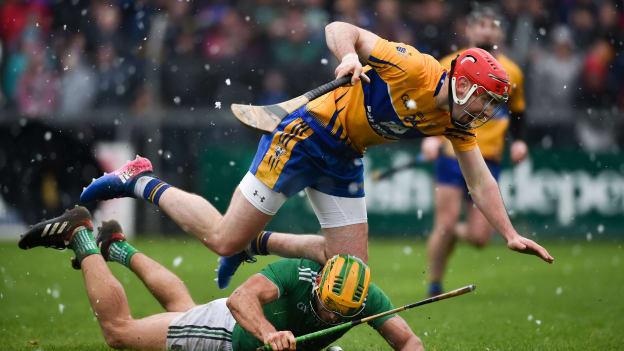 Dan Morrissey, Limerick, and Niall Deasy, Clare, collide at Cusack Park.