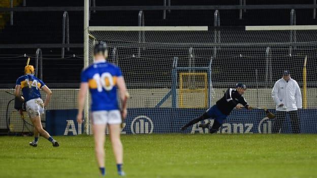 Clare goalkeeper Donal Tuohy breaks his hurley as he saves a penalty from Seamus Callanan of Tipperary during 2019 Allianz Hurling League Division 1A Round 1 match between Tipperary and Clare at Semple Stadium. 