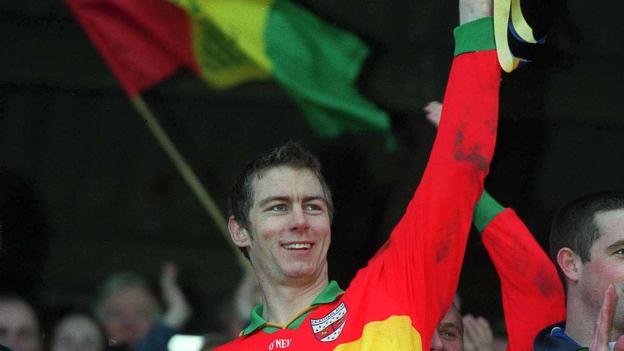 Andrew Corden holds the O'Byrne Cup aloft after captaining Carlow to victory over Wicklow in the 2002 Final. 