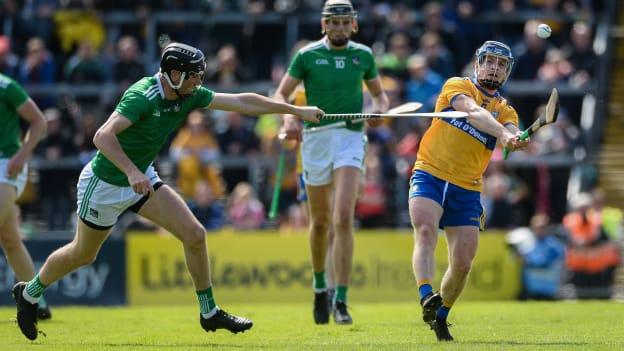 Podge Collins, Clare, and Diarmaid Byrnes, Limerick, during the Munster Senior Hurling Championship clash at the Gaelic Grounds.