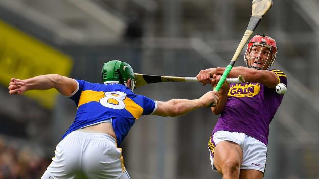 Noel McGrath of Tipperary blocks a shot by Lee Chin of Wexford during the GAA Hurling All-Ireland Senior Championship Semi Final match between Wexford and Tipperary at Croke Park in Dublin.