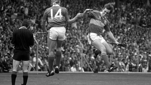 Nicky English celebrates with team-mate Cormac Bonnar after scoring the first of his two goals in the 1989 All-Ireland SHC Final against Antrim. 