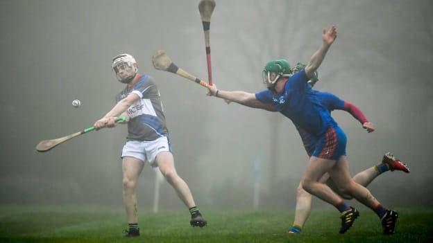 Mickey Mahoney of Waterford IT in action against Tom Barron and Colin O'Brien of Mary Immaculate College during the Fitzgibbon Cup Group A Round 3 match between Mary Immaculate College and Waterford IT at MICL Grounds in Limerick.