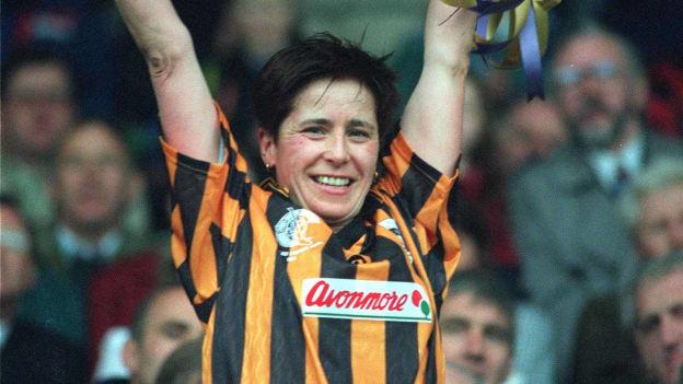 Ann Downey lifts the Cup after captaining Kilkenny to victory over Wexford in the 1994 All-Ireland Camogie Final. 