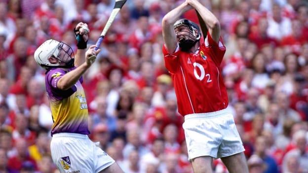 Paul Codd catches the ball above Pat Mulcahy on the way to scoring Wexford's first goal in the drawn 2003 All-Ireland SHC semi-final. 