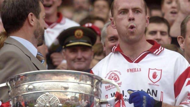 Tyrone captain, Peter Canavan, prepares to lift the Sam Maguire Cup after victory over Armagh in the 2003 All-Ireland SFC Final. 
