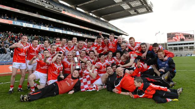 Loughgiel Shamrocks players and management celebrate with the Tommy Moore Cup after victory over Coolderry in the 2012 AIB All-Ireland Club SHC Final. 