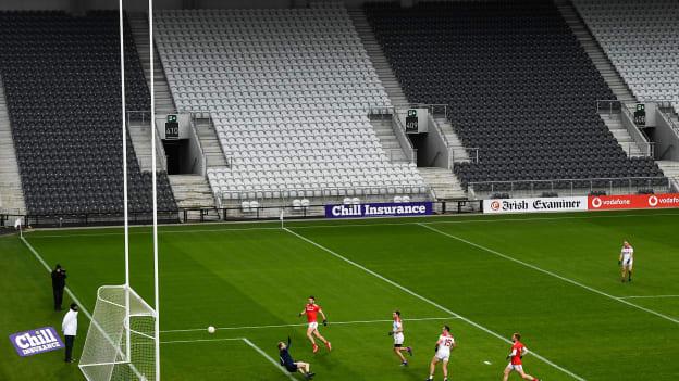 Paul Kerrigan of Cork shoots to score his side's third goal past goalkeeper Craig Lynch of Louth during the Allianz Football League Division 3 Round 6 match between Cork and Louth at Páirc Ui Chaoimh in Cork. 