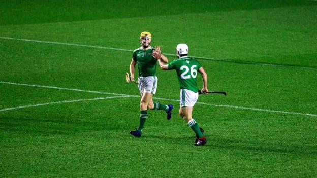 Seamus Flanagan of Limerick, left, celebrates with team-mate Pat Ryan after scoring his side's third goal during the Munster GAA Hurling Senior Championship Semi-Final match between Tipperary and Limerick at Páirc Uí Chaoimh in Cork.