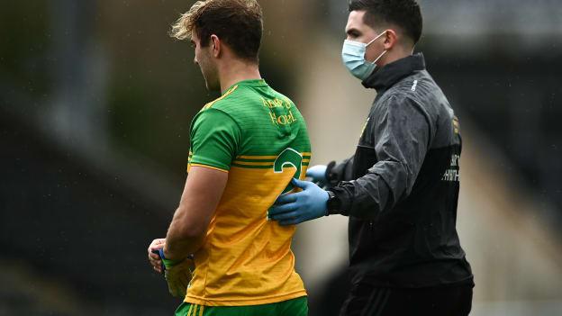 Stephen McMenamin of Donegal leaves the field due to an injury during the Ulster GAA Football Senior Championship Semi-Final match between Donegal and Armagh at Kingspan Breffni in Cavan.