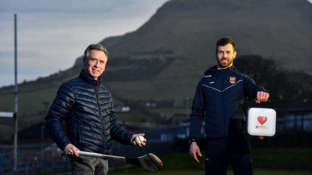 Antrim hurler Neil McManus and his father Hugh at Cushendall GAA Club in Antrim. Neil is an ambassador for the GAA Community Heart Programme which seeks to raise awareness of the benefits of defibrillators to clubs and make it possible to fundraise to acquire them. Neil's work is inspired by his family experience five years ago when his father was saved by the presence of a defibrillator in the community during an emergency. GAA club-based defibrillators have been used to save 42 lives. 