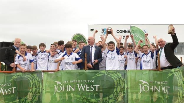 Cian Boran, Naas captain, lifts the Canon Fogarty Trophy after the Division 2 Hurling final at the John West Féile na nGael 2018. 