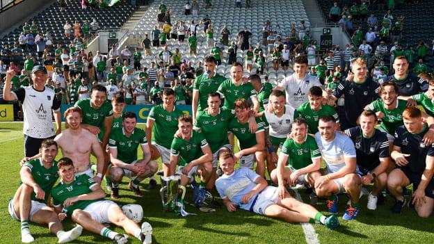 The Limerick players and officials celebrate with the Mick Mackey Cup after the Munster GAA Hurling Senior Championship Final match between Limerick and Tipperary at Páirc Uí Chaoimh in Cork. 