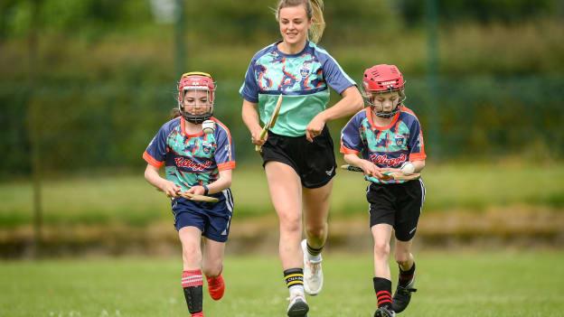 Kilkenny camogie star, Grace Walsh was on hand with Grainne O'Brien, age 10, left, and Rachel McAuliffe, age 10, in Bruff GAA Club, Limerick to mark the first day of the 2021 Kellogg’s GAA Cúl Camps.