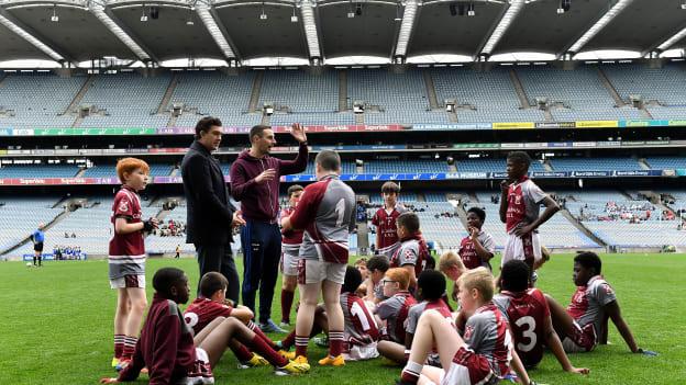 St Aidan's SNS, Brookfield players listen to their coach Mark Moloney, right, during the Corn Mhic Chaoilte Shield Final against St Cronan's SNS, Brackenstown, during day two of the 2019 Allianz Cumann na mBunscol Finals at Croke Park in Dublin. 