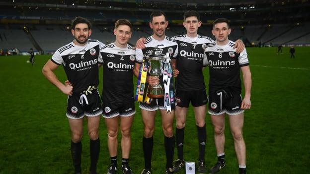 Kilcoo players, from left, Niall Branagan, Aaron Branagan, Aidan Branagan, Eugene Branagan and Daryl Branagan celebrate with the Andy Merrigan cup after the 2022 AIB GAA Football All-Ireland Senior Club Championship Final match between Kilcoo, Down, and Kilmacud Crokes, Dublin, at Croke Park in Dublin.