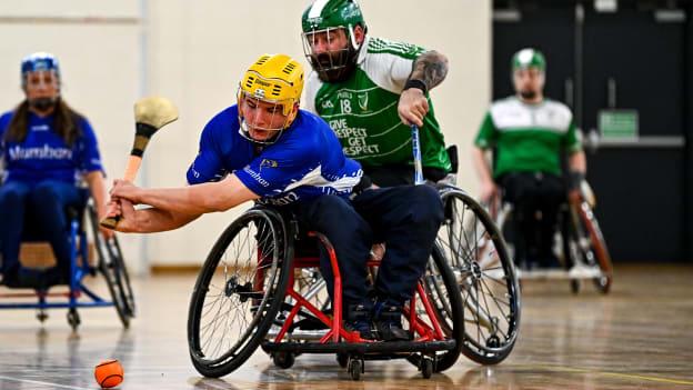 Maurice Noonan of Munster in action against Dermot Berry of Leinster during the M.Donnelly GAA Wheelchair Hurling / Camogie All-Ireland Finals 2022 match between Leinster and Munster at Ashbourne Community School in Ashbourne, Meath.