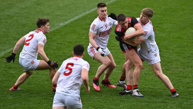Pat Havern of Down under pressure from Cork defenders, from left, Kevin O’Donovan, Rory Maguire, Kevin Flahive and John Cooper during the Allianz Football League Division 2 match between Cork and Down at Páirc Uí Chaoimh in Cork.