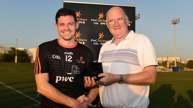Declan Coulter is presented with his man of the match award by GAA President, John Horan. 
