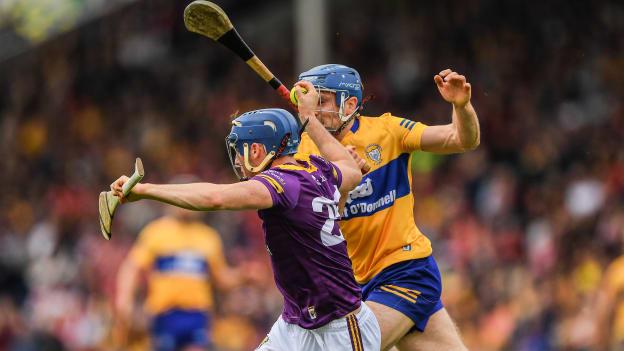 Shane Reck, Wexford, and Shane O'Donnell, Clare, in All Ireland SHC quarter-final action.