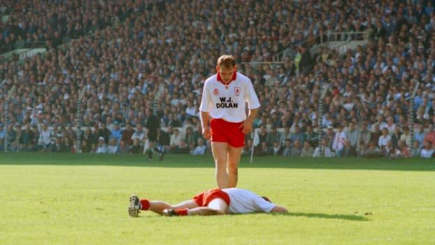 Fay Devlin approaches a dismayed Peter Canavan lying prone on the ground as the final whistle blows in the 1995 All-Ireland SFC Final. 