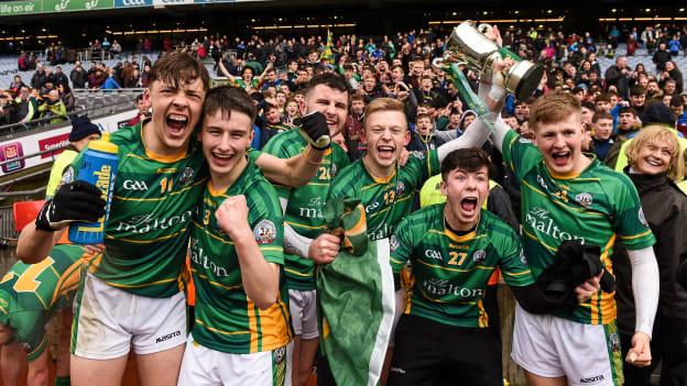 St. Brendan's Killarney players, including, David Clifford, 11, Chris O'Donoghue, 3, Evan Cronin, 13, and 24, Donnchadh O'Sullivan celebrate with the Hogan Cup in 2016.