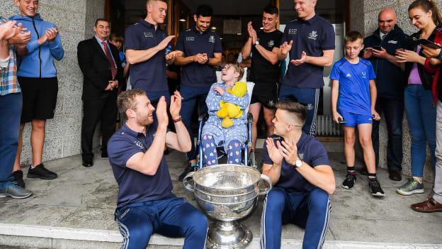 Mary Rose O'Connell, age 12, from Co Waterford pictured with Dublin players, back row, from left, Con O'Callaghan, Cian O'Sullivan, Brian Howard, Rob McDaid and front row Jack McCaffrey, left, and Eoin Murchan and the Sam Maguire Cup on a visit by the All-Ireland Senior Football Champions to the Children's Health Ireland at Crumlin in Dublin. 