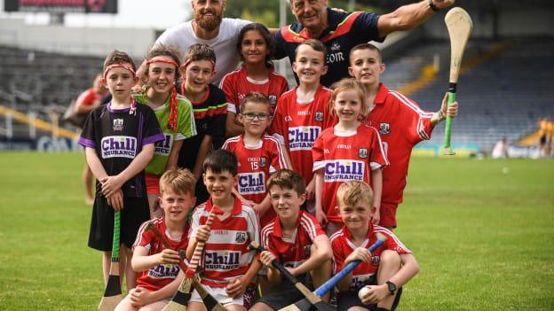 Cork manager John Meyler with his son and Republic of Ireland footballer David Meyler and Cork supporters from Bride Rovers GAA club after victory over Clare in the Munster SHC Final. 