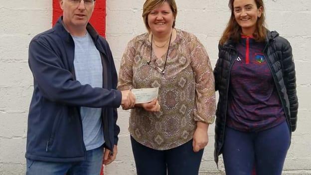 Treasa Ryan and Tom Bourke from Oola Healthy Clubs Committee pictured with Mary Purcell, who represented GROW following a fundraiser organised by the club.