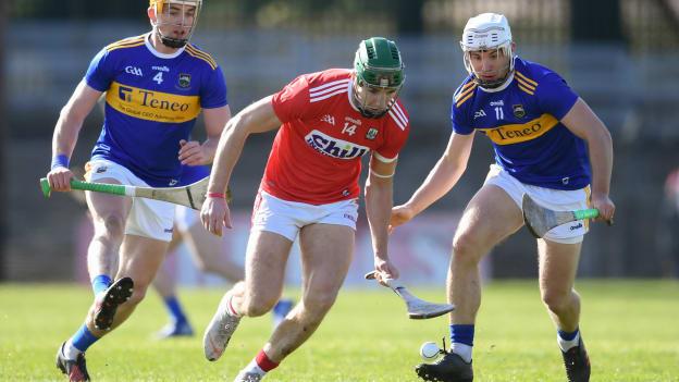 Alan Cadogan, Cork, being challenged by Niall O'Meara, Tipperary, at Pairc Ui Rinn.